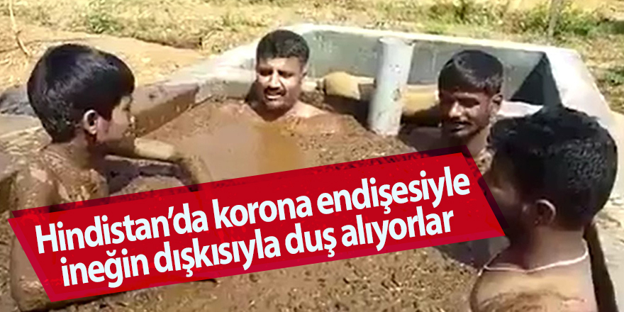 Hindistan’da korona endişesiyle ineğin dışkısıyla duş alıyorlar