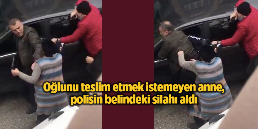 Oğlunu teslim etmek istemeyen anne, polisin belindeki silahı aldı