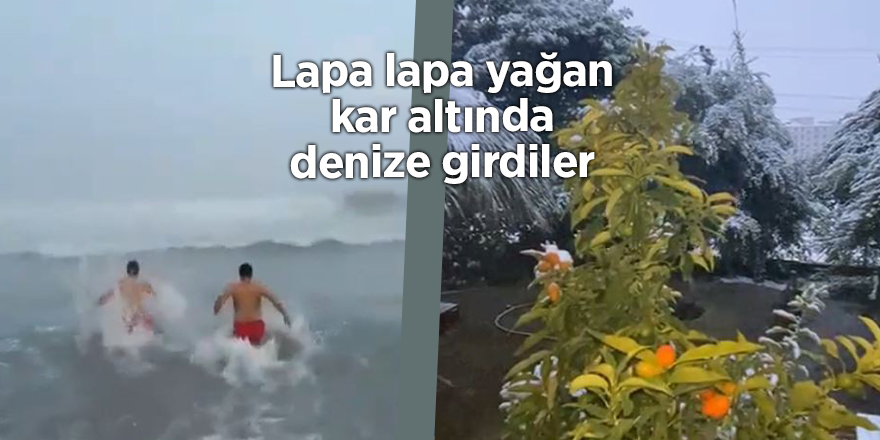 Lapa lapa yağan kar altında denize girdiler