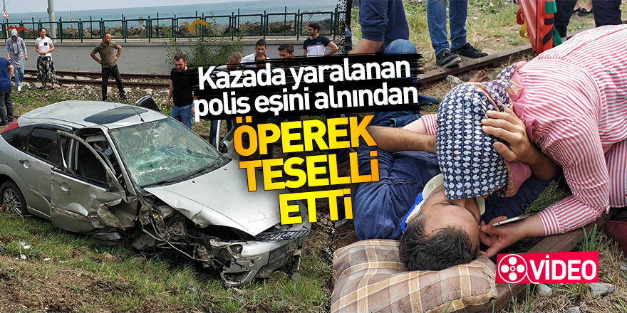 Kazada yaralanan polis eşini alnından öperek teselli etti