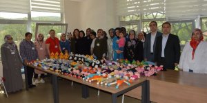 Suriyeli yetimlere örgü bebek ve eşofman