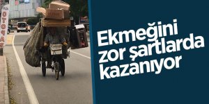 Ekmeğini zor şartlarda kazanıyor 