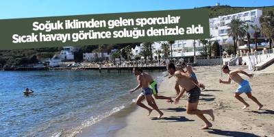 Soğuk iklimden gelen sporcular sıcak havayı görünce soluğu denizde aldı